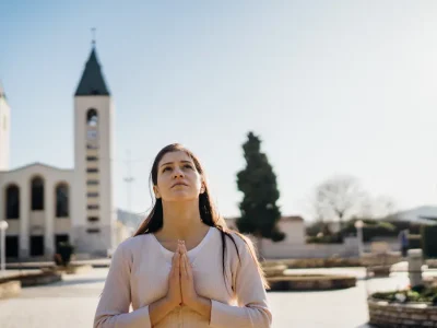 Praying in front of St. James Church in Medjugorje