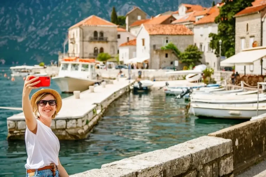 Perast, Montenegro – Woman Taking a Selfie on the Bay of Kotor Waterfront